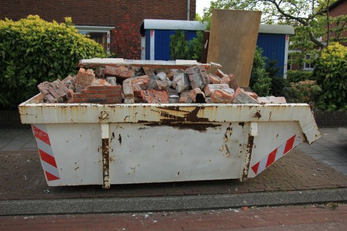 Wait and Load skip being delivered to a Hackney property site