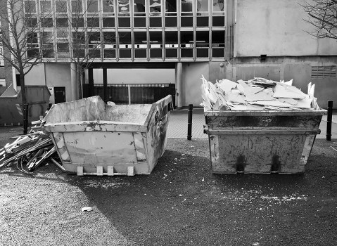 Construction workers managing waste on a building site in Hackney