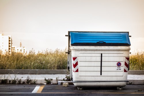 Skip hire container being delivered to a Hackney location